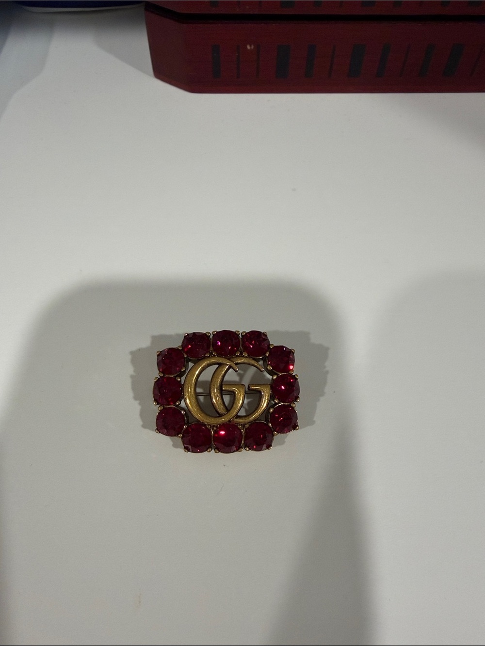Gucci Gold-Tone Double G Brooch with Red Stones